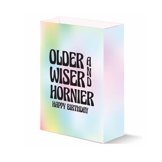 Pastel tie-dye 'Older, Wiser, Hornier' birthday gift bag, adding a humorous touch to birthday celebrations.