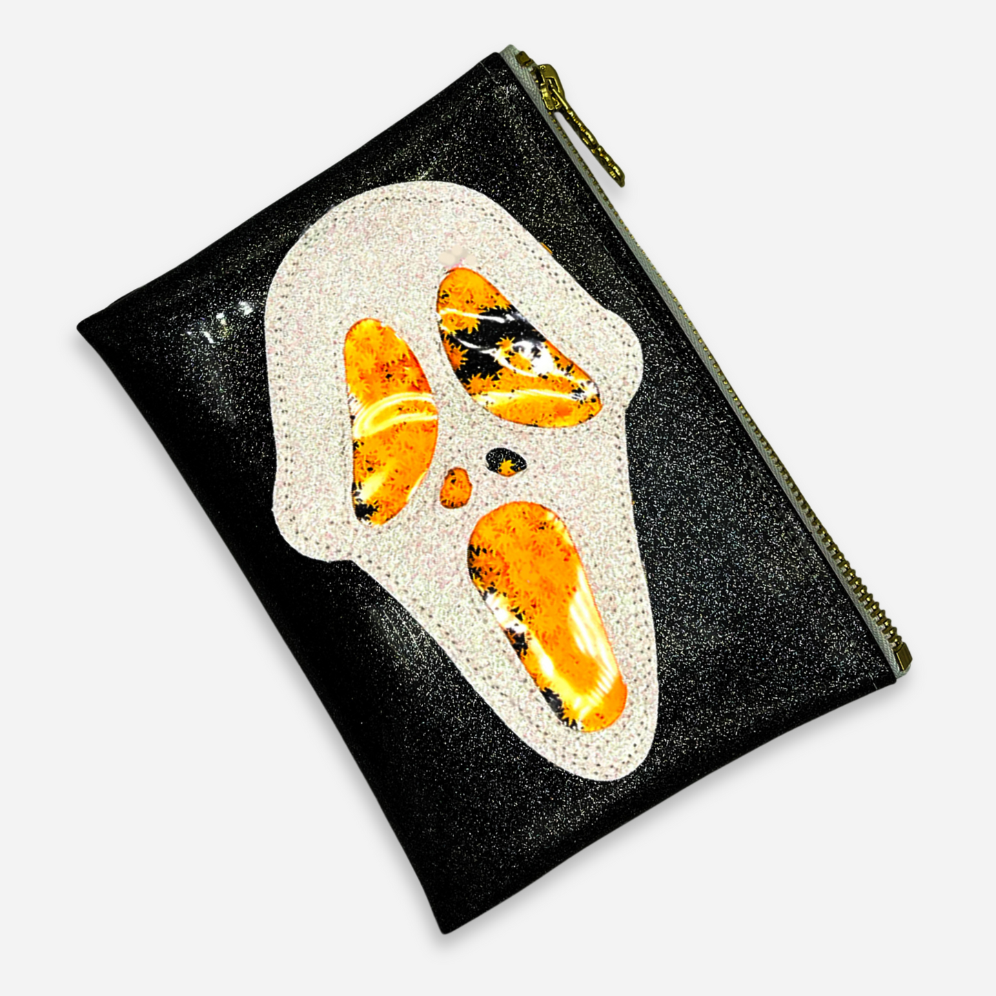 Midi Ghostface Kush Clutch with orange cannabis leaf glitter, angled view