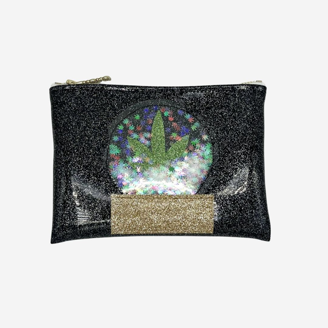 Black glitter clutch featuring a cannabis leaf snow globe with iridescent confetti and a gold glitter base