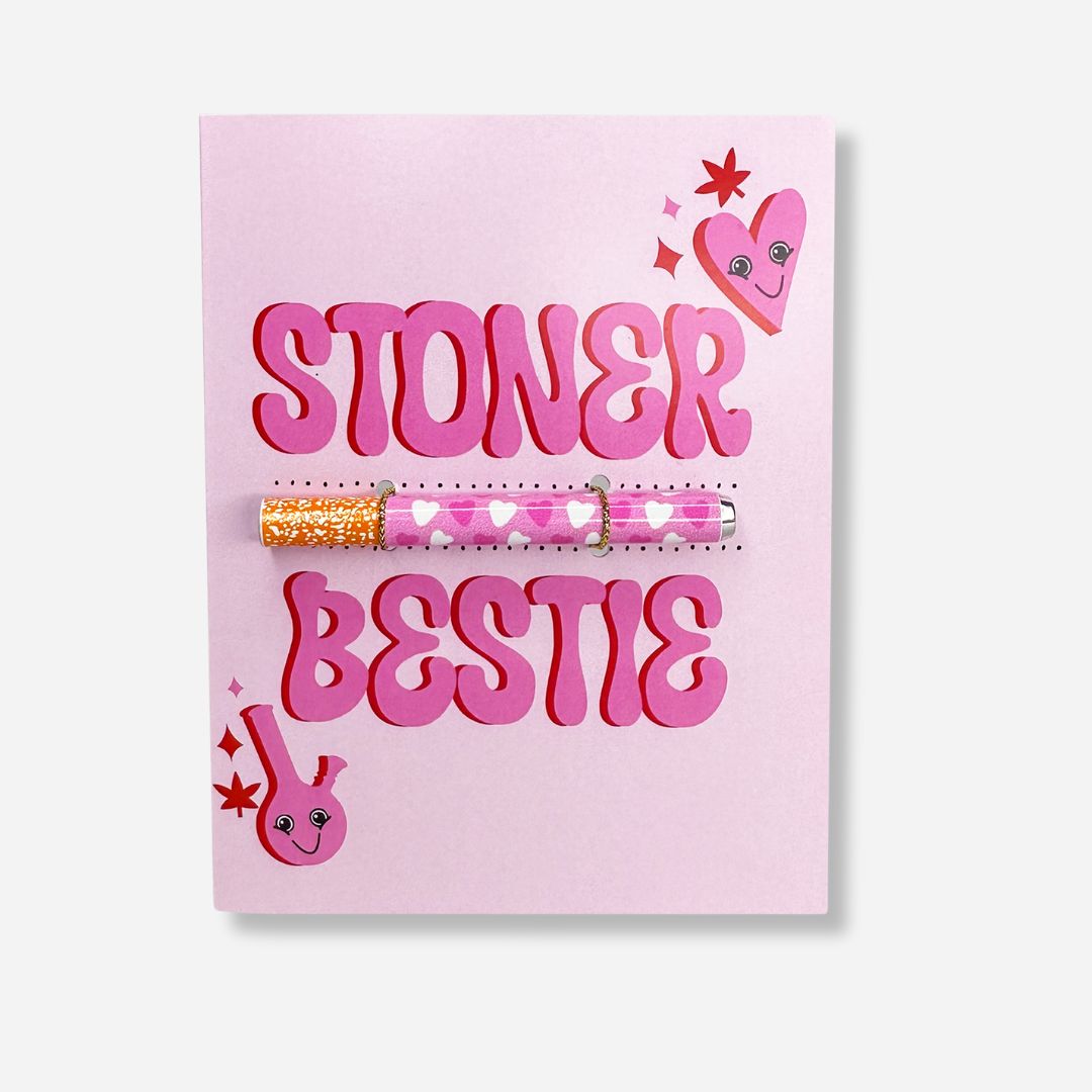 A fun and affectionate greeting card with a vibrant pink background, featuring the words 'STONER BESTIE' in bold red letters. The design includes a whimsical cannabis leaf pattern and tiny hearts, encapsulating a warm-hearted celebration of friendship and shared interests.