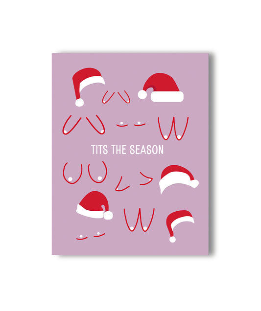 Festive lavender holiday card with cartoon breasts wearing Santa hats, with the phrase 'TITS THE SEASON' in bold typography.