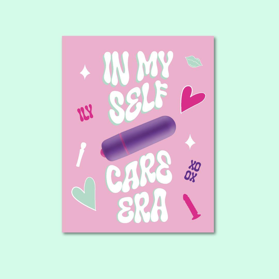 A playful greeting card with a pink background featuring the phrase 'In My Self Care Era' in bold, stylized white and mint green letters. A purple vibrator is prominently displayed in the center, signifying the card's humorous and self-love theme. Additional decorations include small hearts, a lipstick kiss mark, and the playful sign-off 'XO.'