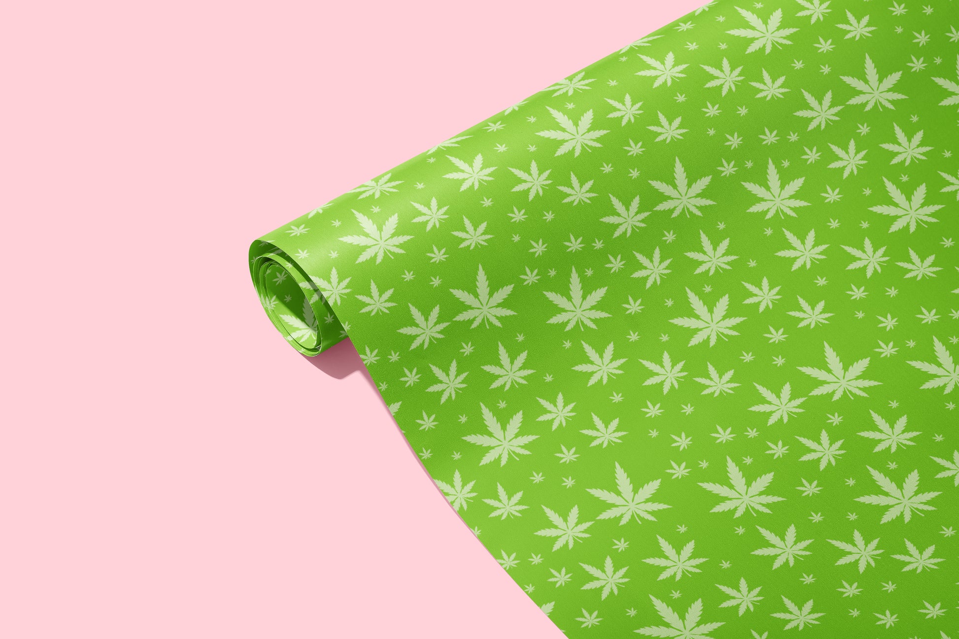 Green wrapping paper roll with light green pot leafs scattered in different sizes