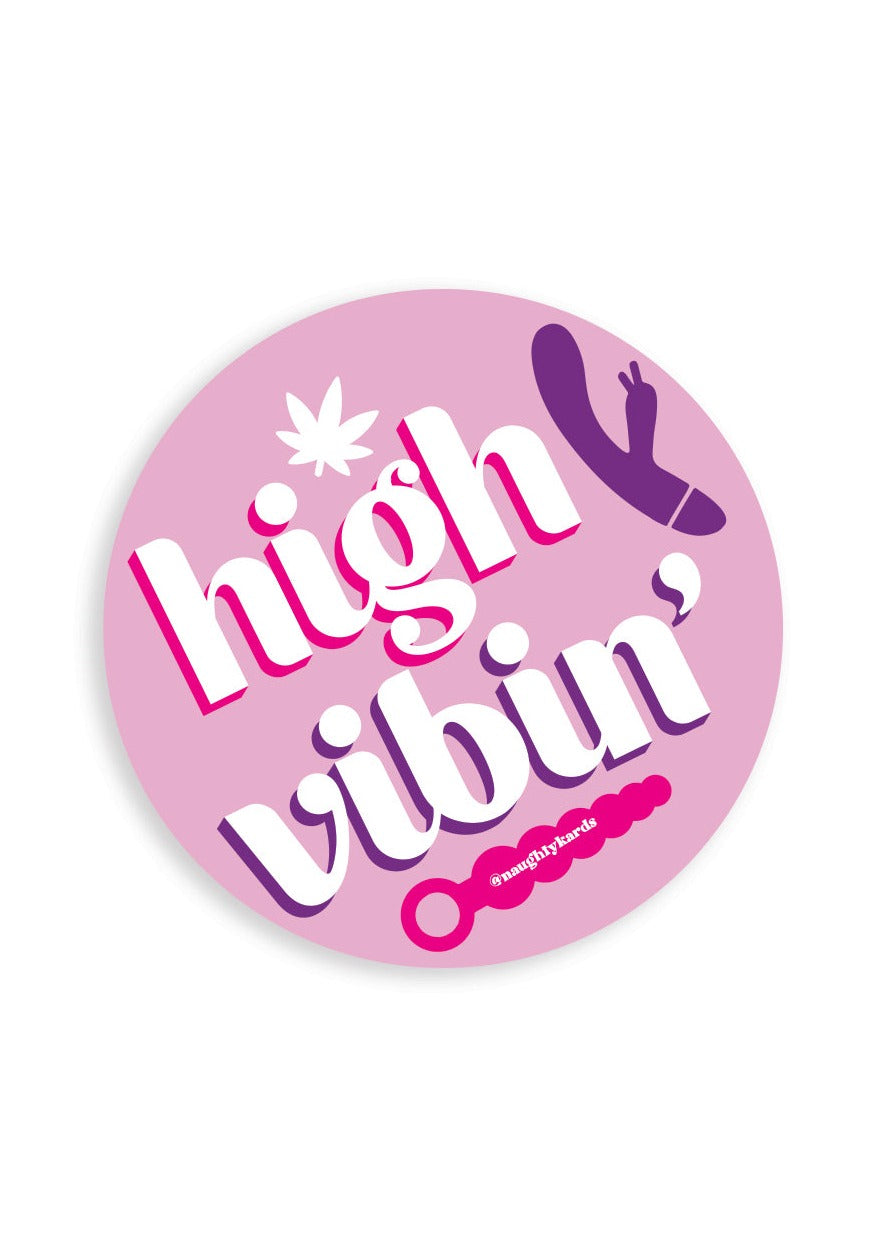 Matte vinyl circle sticker with a light purple background and graphics of vibrators and a pot leaf. The sticker reads in white lettering "high vibin'"