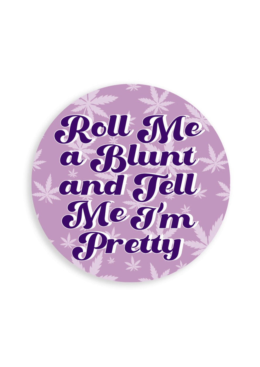 Matte Vinyl sticker with light purple background with lighter purple pot leaves all over. It reads in dark purple lettering "Roll me a blunt and tell me i'm pretty"