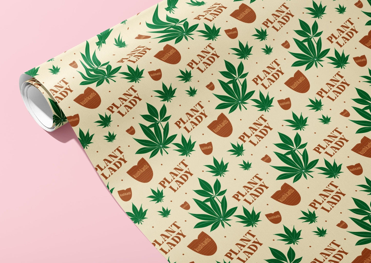 Wrapping paper rolled up with all over print of cannabis pot leafs, pot for plants with KushKards logo, and the words "Plant Lady". Ivory background, green leaves, brown words and pots. 